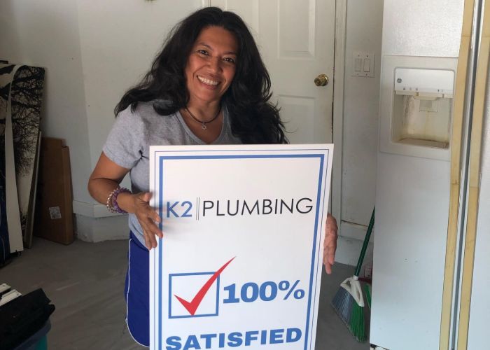 customer happy after kitchen plumbing services in Hollywood FL